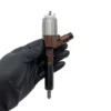 Single Caterpillar diesel fuel injector view 4