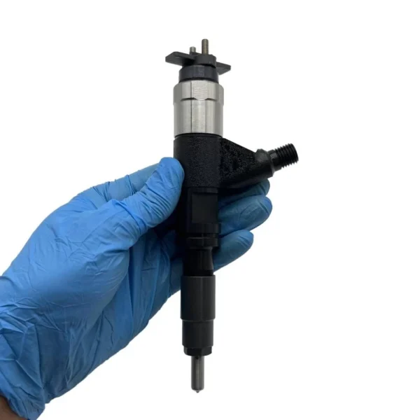 295050-1380 Denso Diesel Fuel Injector Hand View Hand-held view of 295050-1380 Denso diesel injector for John Deere 5065E